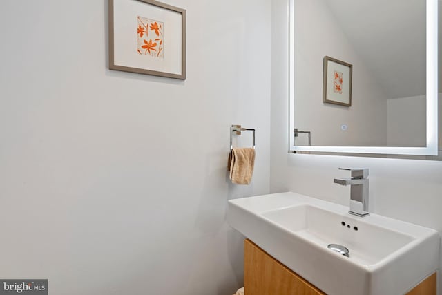 135 13th St NE, Washington, DC 20002 - bathroom with vanity and lofted ceiling