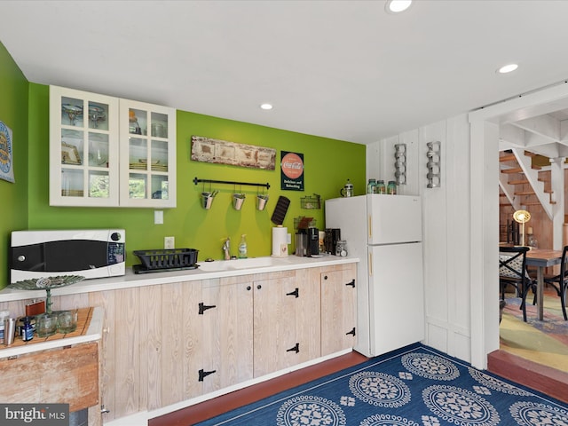 417 S Main St, Berlin, MD 21811 - kitchen featuring white appliances, a sink, glass insert cabinets, recessed lighting, and light countertops
