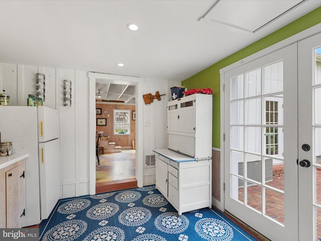 417 S Main St, Berlin, MD 21811 - doorway to outside featuring wood walls and recessed lighting