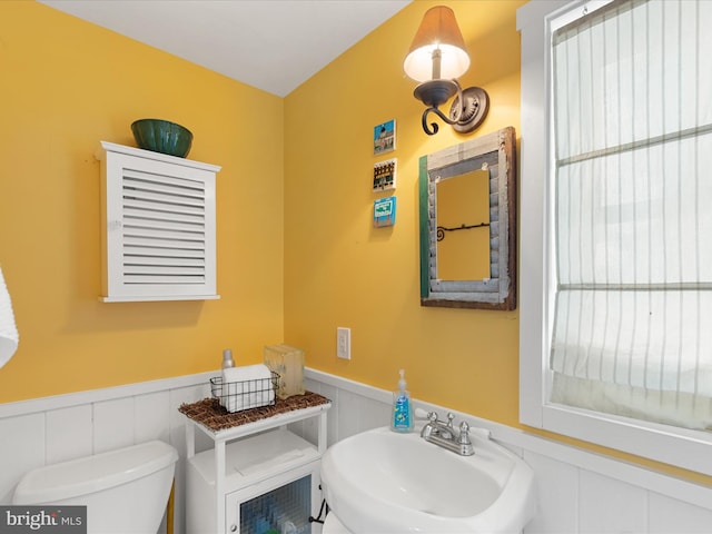 417 S Main St, Berlin, MD 21811 - half bath featuring wainscoting, a sink, and toilet