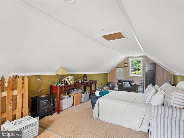 417 S Main St, Berlin, MD 21811 - bedroom with a wood stove, lofted ceiling, and wood finished floors