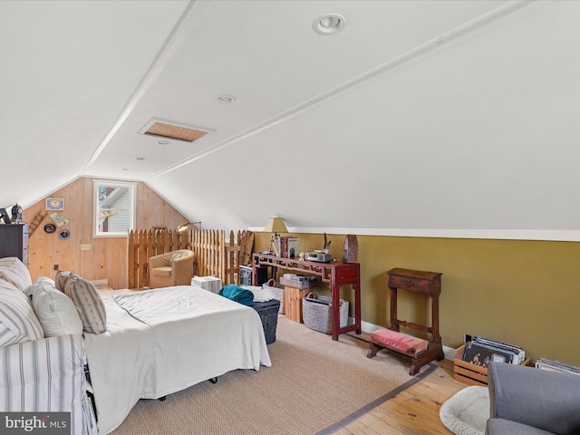 417 S Main St, Berlin, MD 21811 - bedroom with vaulted ceiling, hardwood / wood-style floors, wood walls, and baseboards