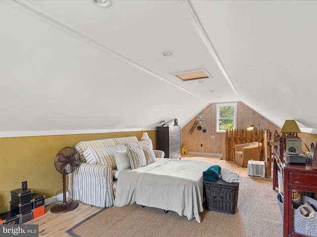 417 S Main St, Berlin, MD 21811 - bedroom with lofted ceiling, wood finished floors, and wood walls