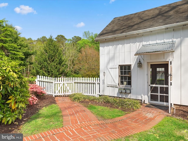 417 S Main St, Berlin, MD 21811 - property entrance with board and batten siding and roof with shingles