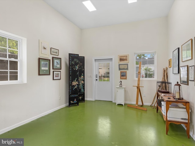 417 S Main St, Berlin, MD 21811 - misc room featuring finished concrete floors, baseboards, and plenty of natural light