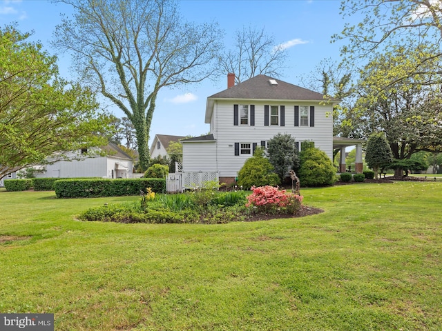 417 S Main St, Berlin, MD 21811 - back of house with a yard and a chimney
