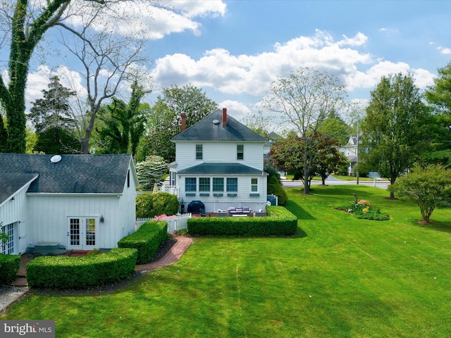 417 S Main St, Berlin, MD 21811 - rear view of property with french doors, a chimney, roof with shingles, and board and batten siding