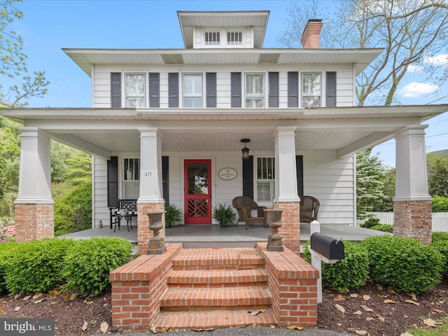 417 S Main St, Berlin, MD 21811 - american foursquare style home featuring a porch and a chimney
