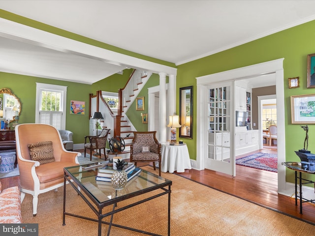 417 S Main St, Berlin, MD 21811 - living area with wood finished floors, baseboards, stairs, and ornamental molding
