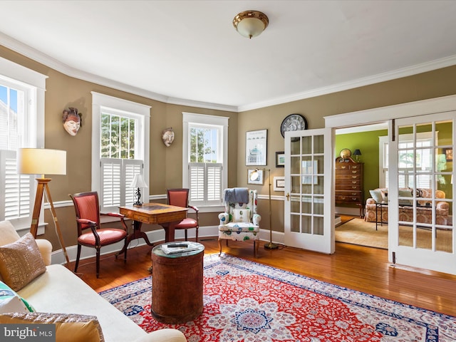 417 S Main St, Berlin, MD 21811 - living room with wood finished floors, ornamental molding, baseboards, and french doors