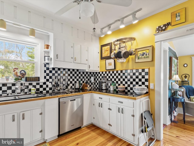 417 S Main St, Berlin, MD 21811 - kitchen with dishwasher, tile counters, a sink, track lighting, and white cabinets