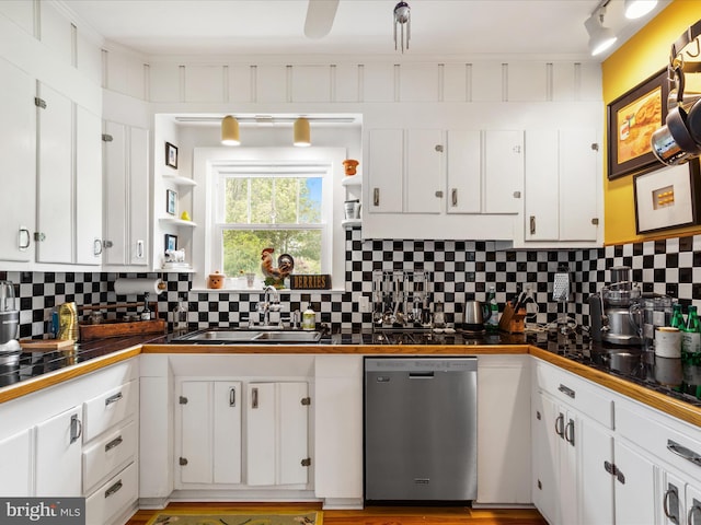 417 S Main St, Berlin, MD 21811 - kitchen featuring stainless steel dishwasher, a sink, open shelves, and white cabinetry