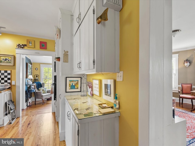 417 S Main St, Berlin, MD 21811 - bar featuring light wood-style floors and ornamental molding