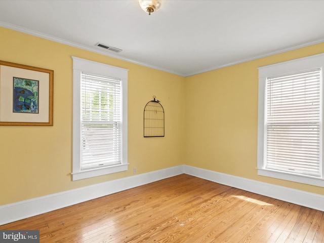 417 S Main St, Berlin, MD 21811 - unfurnished room featuring light wood-type flooring, ornamental molding, and baseboards
