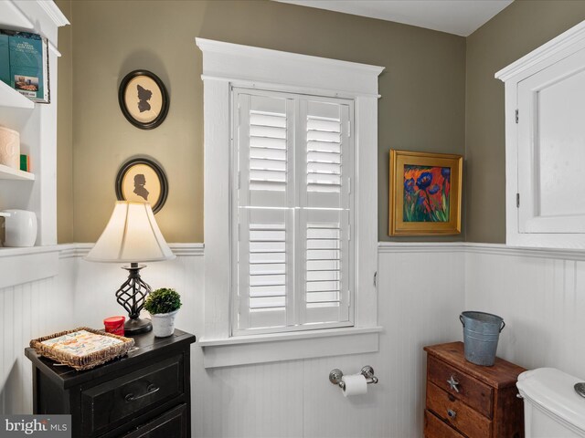 417 S Main St, Berlin, MD 21811 - bathroom featuring wainscoting, toilet, and healthy amount of natural light