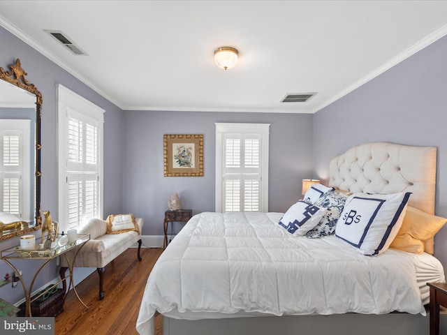 417 S Main St, Berlin, MD 21811 - bedroom featuring crown molding, wood finished floors, multiple windows, and baseboards
