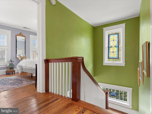 417 S Main St, Berlin, MD 21811 - corridor featuring healthy amount of natural light, wood finished floors, crown molding, and an upstairs landing
