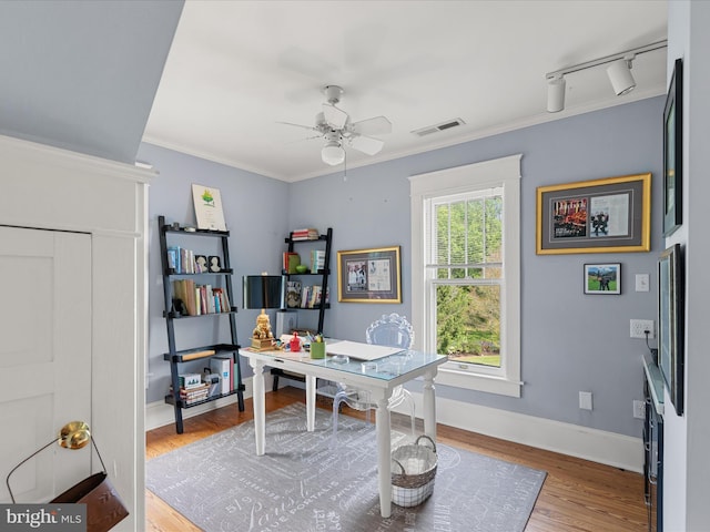417 S Main St, Berlin, MD 21811 - home office with a ceiling fan, wood finished floors, baseboards, and crown molding