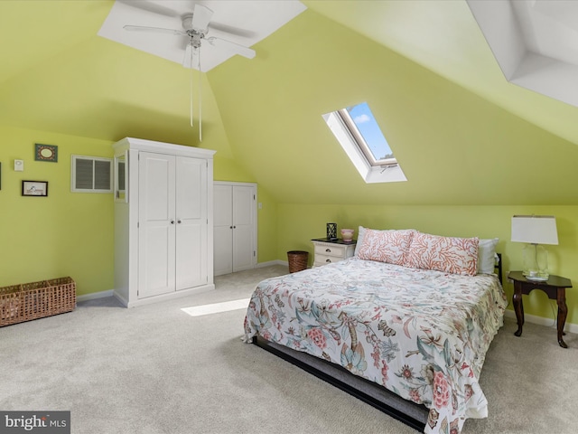 417 S Main St, Berlin, MD 21811 - carpeted bedroom with vaulted ceiling, baseboards, a skylight, and ceiling fan