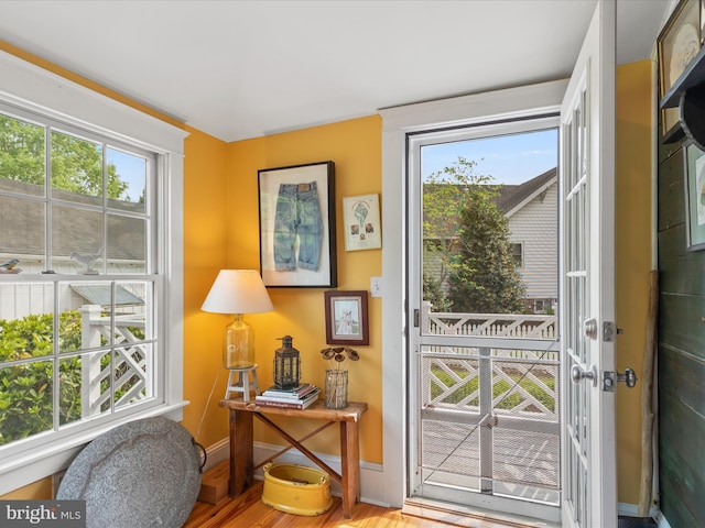 417 S Main St, Berlin, MD 21811 - doorway to outside featuring wood finished floors and baseboards