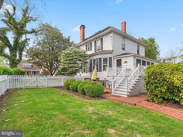 417 S Main St, Berlin, MD 21811 - back of house featuring stairs, a chimney, and a deck