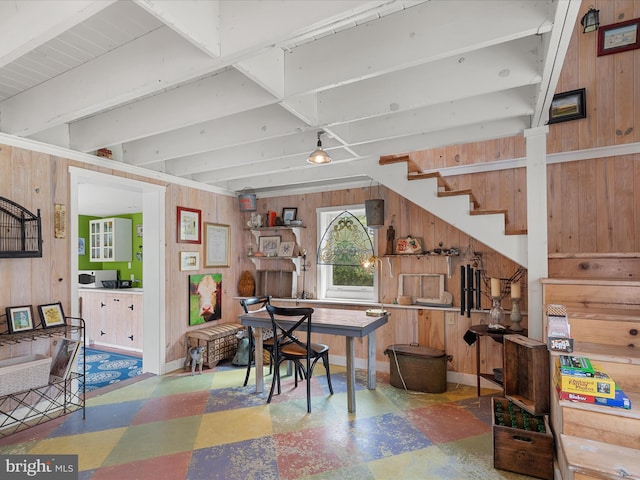 417 S Main St, Berlin, MD 21811 - dining space with tile patterned floors, wood walls, and stairway