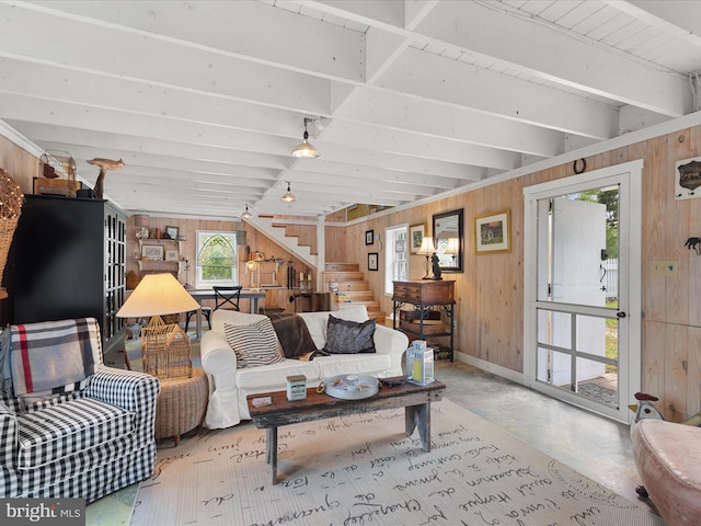 417 S Main St, Berlin, MD 21811 - living area with stairs, wood walls, concrete flooring, baseboards, and beamed ceiling