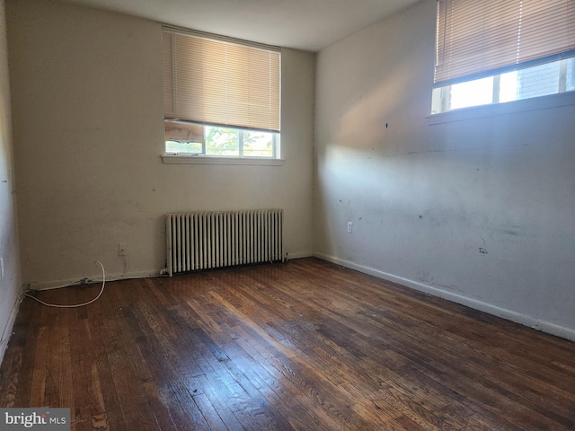 210 Webster St NE, Washington, DC 20011 - unfurnished room with radiator heating unit, hardwood / wood-style flooring, and baseboards
