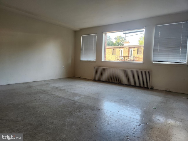 210 Webster St NE, Washington, DC 20011 - empty room with radiator and concrete floors
