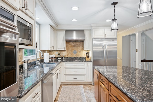 276 Cherry Ln, Doylestown, PA 18901 - kitchen with wall chimney range hood, built in appliances, a sink, decorative backsplash, and white cabinetry