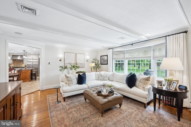 276 Cherry Ln, Doylestown, PA 18901 - living area with light wood-type flooring, baseboards, and beamed ceiling