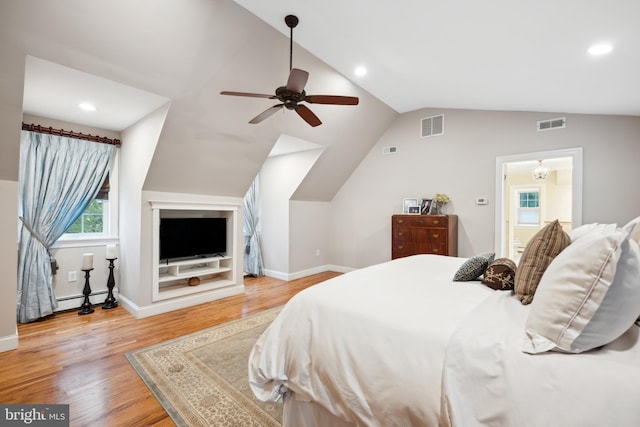 276 Cherry Ln, Doylestown, PA 18901 - bedroom with wood finished floors, vaulted ceiling, baseboards, a baseboard radiator, and recessed lighting