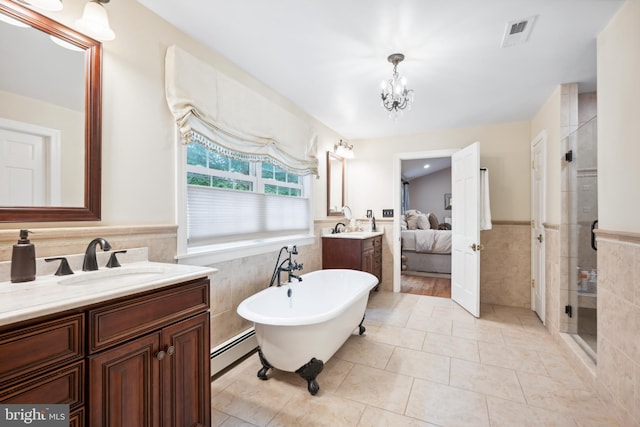 276 Cherry Ln, Doylestown, PA 18901 - full bath featuring tile walls, a stall shower, vanity, baseboard heating, and a soaking tub