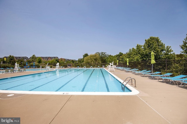 22287 Cornerstone Crossing Ter, Ashburn, VA 20148 - community pool with a patio area