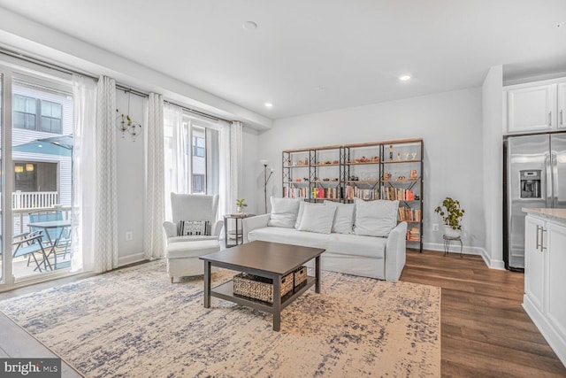22287 Cornerstone Crossing Ter, Ashburn, VA 20148 - living room with dark wood-style flooring, recessed lighting, and baseboards