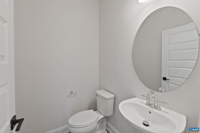 8 Talen Ln, Charlottesville, VA 22911 - half bath with a sink, toilet, and baseboards
