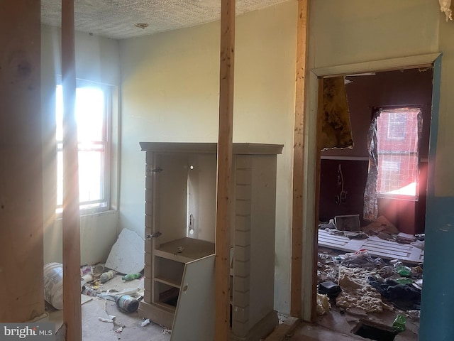 1821 Wilhelm St, Baltimore, MD 21223 - corridor featuring a textured ceiling