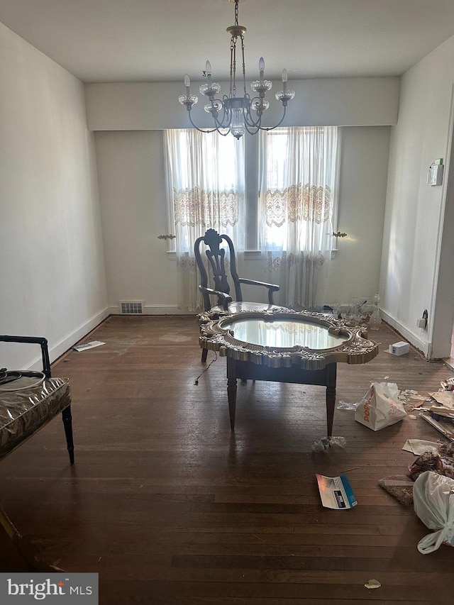 1902 T St SE, Washington, DC 20020 - dining room featuring a chandelier, wood finished floors, and baseboards