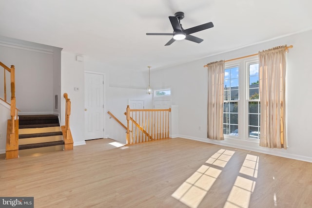 21055 Cornerpost Sq, Ashburn, VA 20147 - unfurnished room with light wood-type flooring, a ceiling fan, and baseboards