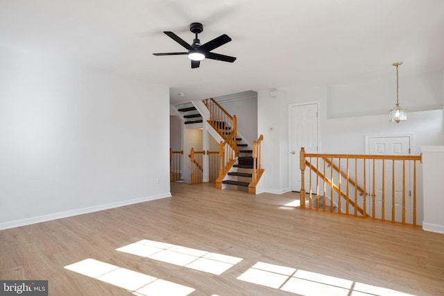 21055 Cornerpost Sq, Ashburn, VA 20147 - empty room with wood finished floors, baseboards, and ceiling fan