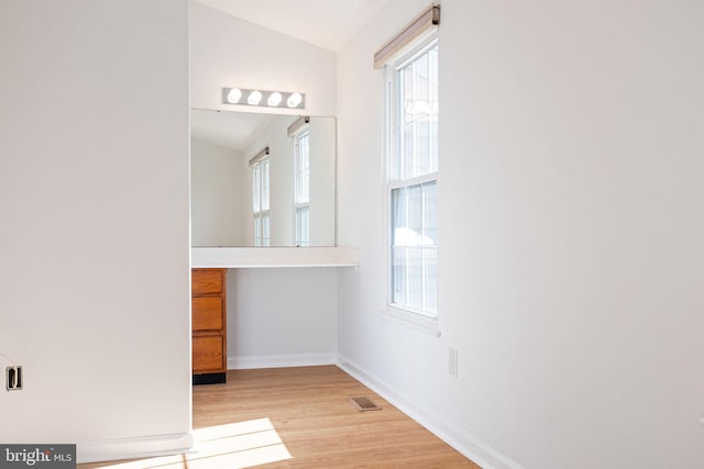 21055 Cornerpost Sq, Ashburn, VA 20147 - hall with vaulted ceiling, baseboards, and light wood-type flooring