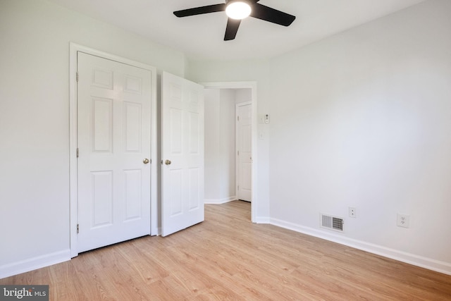 21055 Cornerpost Sq, Ashburn, VA 20147 - unfurnished bedroom featuring light wood-style floors, baseboards, and ceiling fan