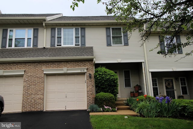 319 Fieldstone Dr, New Hope, PA 18938 - townhome / multi-family property featuring brick siding, an attached garage, and driveway