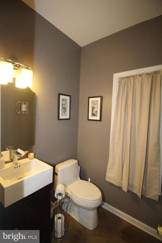 319 Fieldstone Dr, New Hope, PA 18938 - half bathroom with toilet, tile patterned floors, vanity, and baseboards