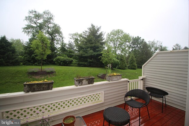 319 Fieldstone Dr, New Hope, PA 18938 - deck featuring a lawn, view of wooded area, and an outdoor fire pit