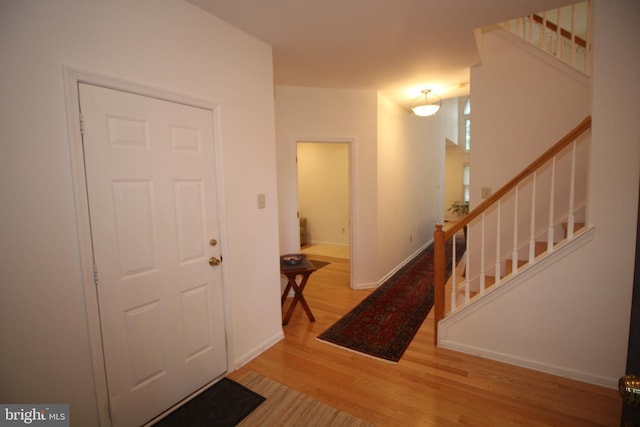 319 Fieldstone Dr, New Hope, PA 18938 - foyer featuring wood finished floors, stairway, and baseboards