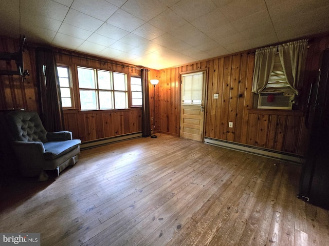 305 Raccoon Dr, Winchester, VA 22602 - foyer entrance featuring a baseboard radiator, baseboard heating, hardwood / wood-style floors, cooling unit, and wooden walls