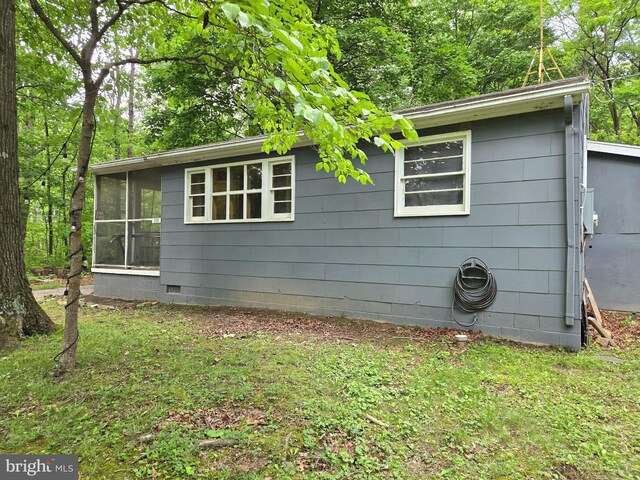 305 Raccoon Dr, Winchester, VA 22602 - view of home's exterior with a sunroom, crawl space, and a lawn