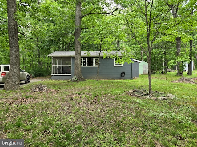 305 Raccoon Dr, Winchester, VA 22602 - rear view of property with a sunroom and a yard