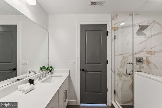 1007 Bryant St NE Unit 3, Washington, DC 20018 - full bath with vanity, a marble finish shower, and washer / clothes dryer